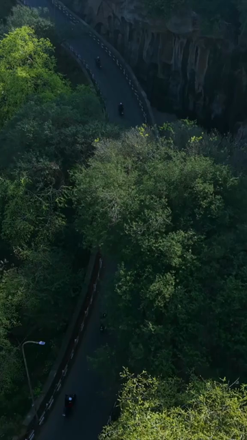 Vertical Aerial View of Bikers Riding Along Gwalior Fort Road Madhya Pradesh India