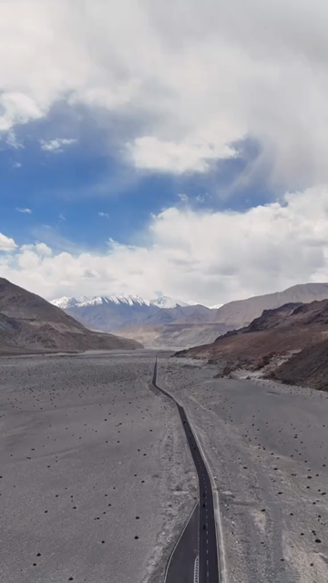 Vertical Aerial View of Bikers Riding on a Mountain Road in Ladakh, Indian Himalayas