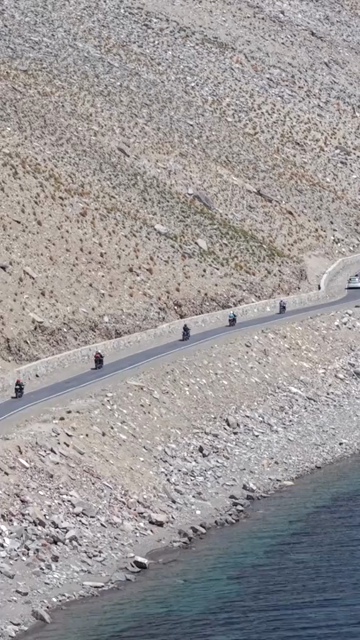 Vertical Aerial View of Tourist Bikers at Pangong Lake Ladakh India