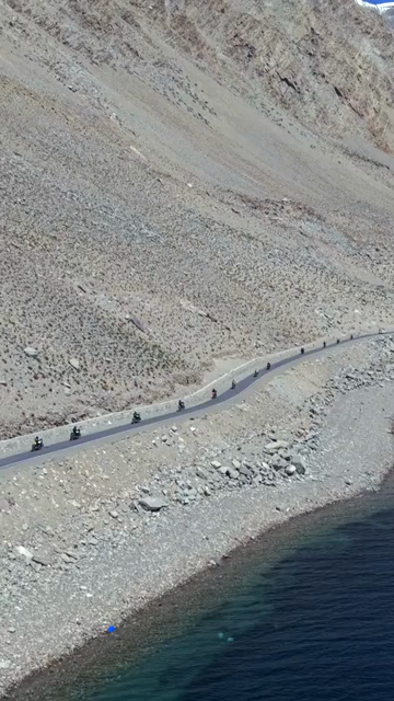 Vertical Aerial View of Tourist Bikers at Pangong Lake Ladakh India