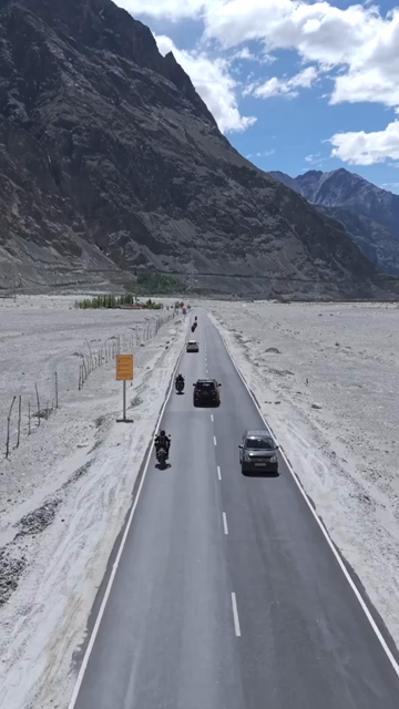 Vertical Aerial View of Bikers on Mountain Road in Ladakh India