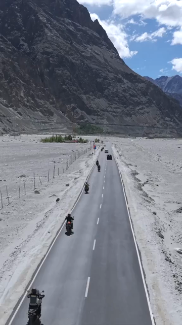 Vertical Aerial View of Bikers on Mountain Road in Ladakh India
