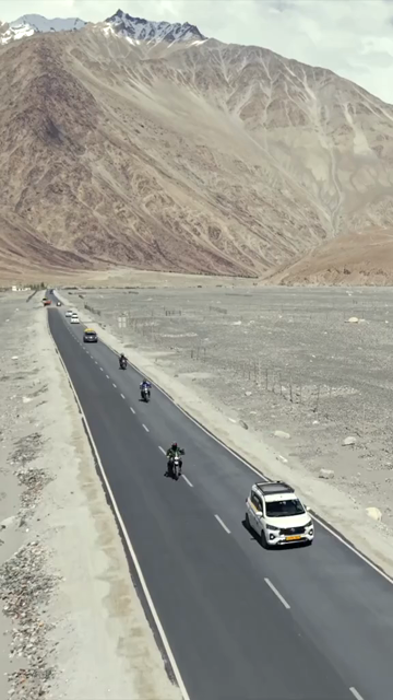 Vertical Aerial View of Bikers on Mountain Road in Ladakh India