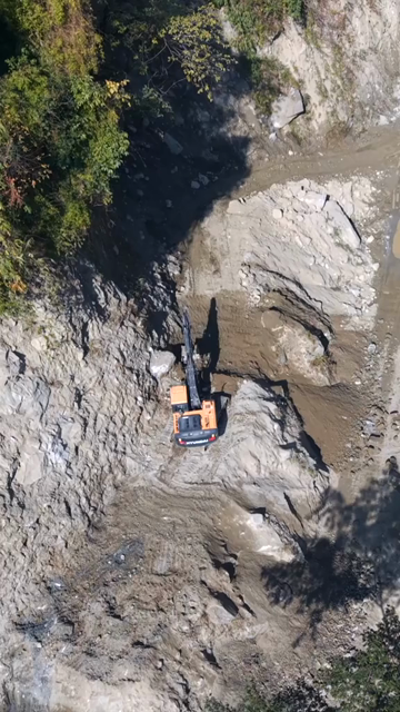 20th April 2026 : Vertical Aerial View of Mountain Road Construction and Landslide Clearing in India