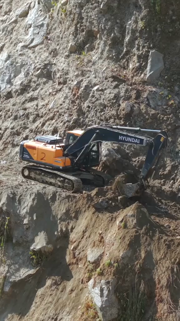20th April 2026 : Vertical Aerial View of Mountain Road Construction and Landslide Clearing in India