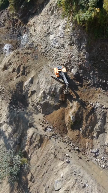 20th April 2026 : Vertical Aerial View of Mountain Road Construction and Landslide Clearing in India