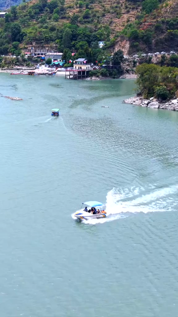 Vertical Aerial View of Chamera Lake with Speedboat, Himachal Pradesh, India