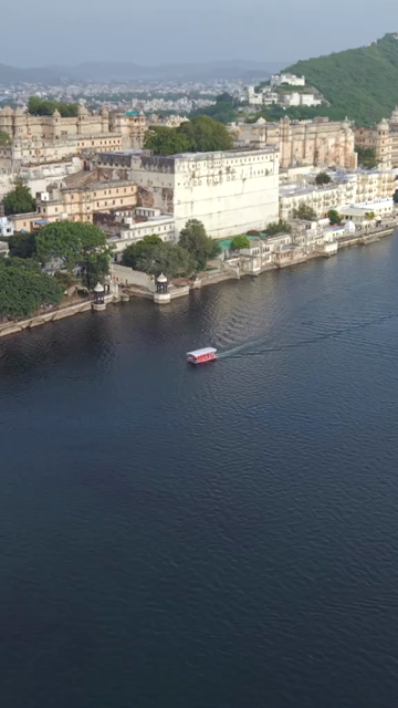 Vertical Aerial View of City Palace and Lake Pichola Udaipur Rajasthan India