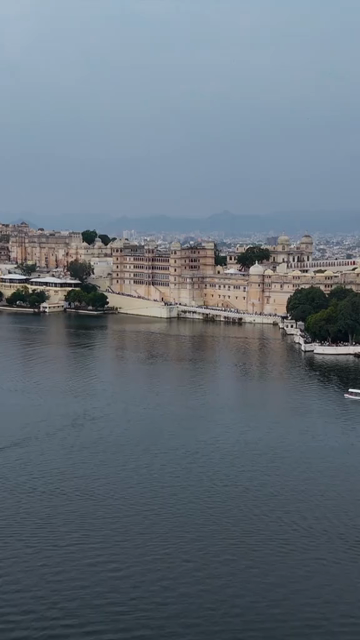 Vertical Aerial View of City Palace and Lake Pichola Udaipur Rajasthan India