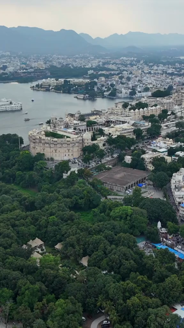 Vertical Aerial View of City Palace and Lake Pichola Udaipur Rajasthan India