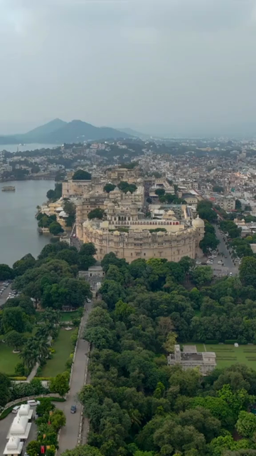 Vertical Aerial View of City Palace and Lake Pichola Udaipur Rajasthan India