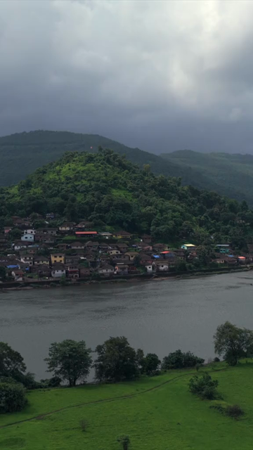 Vertical Aerial View of Dasgaon Village and Savitri River with Konkan Railway Bridge Maharashtra