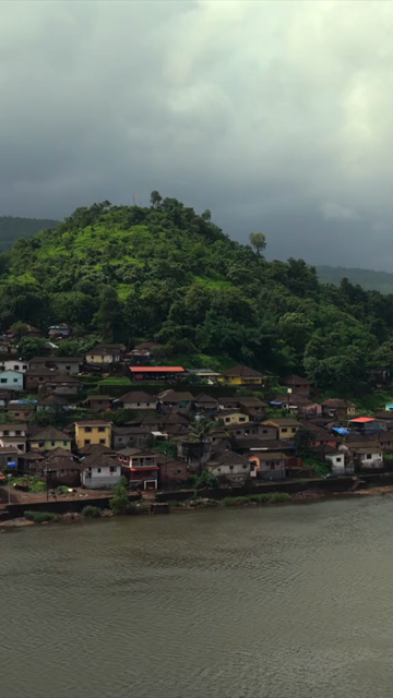 Vertical Aerial View of Dasgaon Village and Savitri River with Konkan Railway Bridge Maharashtra