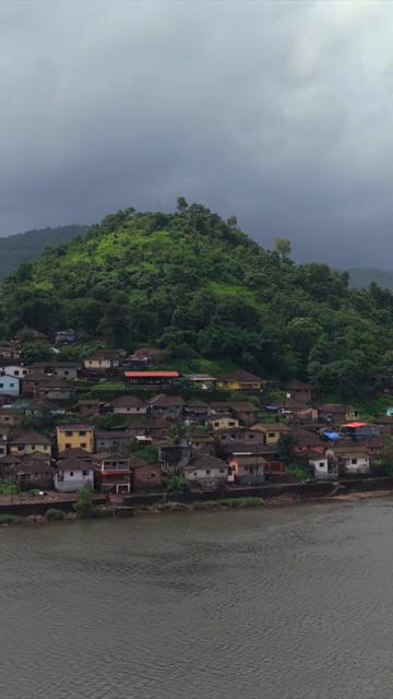 Vertical Aerial View of Dasgaon Village and Savitri River with Konkan Railway Bridge Maharashtra