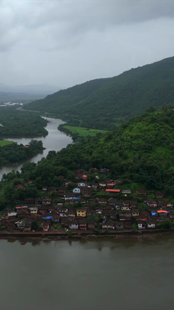 Vertical Aerial View of Dasgaon Village and Savitri River with Konkan Railway Bridge Maharashtra