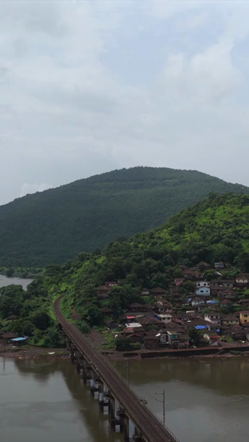 Vertical Aerial View of Dasgaon Village and Savitri River with Konkan Railway Bridge Maharashtra