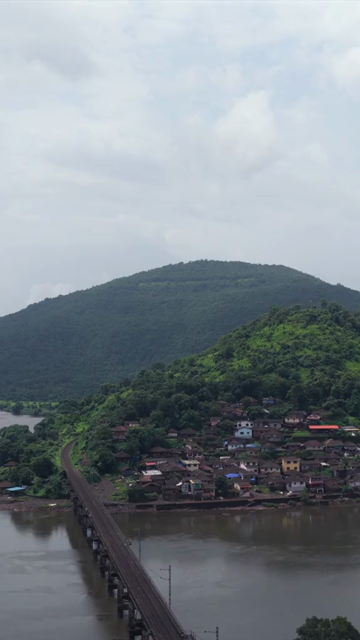 Vertical Aerial View of Dasgaon Village and Savitri River with Konkan Railway Bridge Maharashtra
