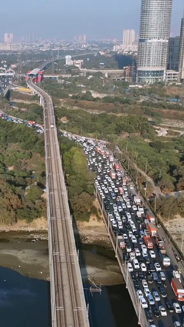 Vertical Aerial View of Delhi Metro and Traffic at Kalindi Kunj Bridge India