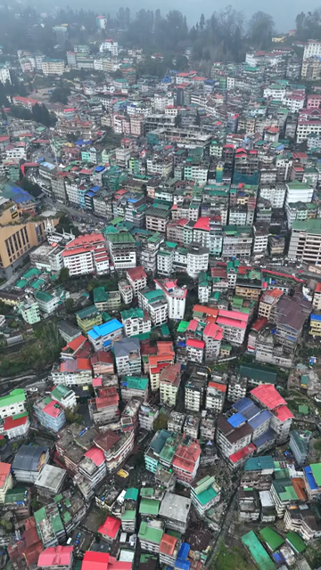 Vertical Aerial View of Gangtok Cityscape and Hillside Buildings Sikkim India