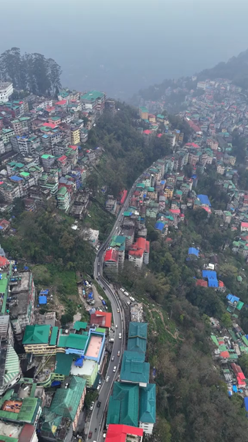 Vertical Aerial View of Gangtok Cityscape and Hillside Buildings Sikkim India