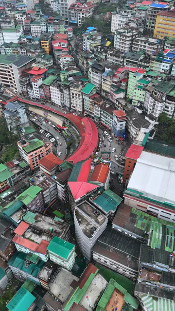 Vertical Aerial View of Gangtok Cityscape and Hillside Buildings Sikkim India
