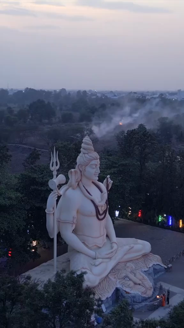 Vertical Aerial View of Giant Lord Shiva Statue and Devotees in Jabalpur