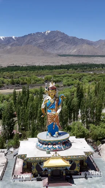 Vertical Aerial View of Guru Padmasambhava Statue and Himalayan Landscape in Ladakh India