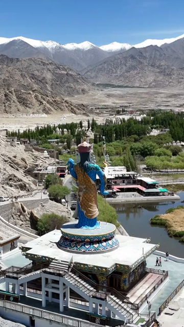Vertical Aerial View of Guru Padmasambhava Statue and Himalayan Landscape in Ladakh India