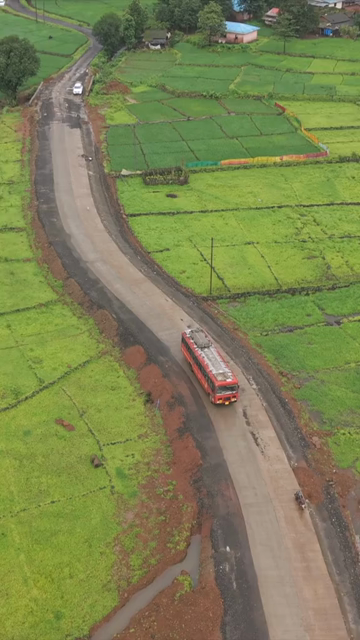 Vertical Aerial View of Lush Green Hills and Winding Roads in Ratnagiri Maharashtra India