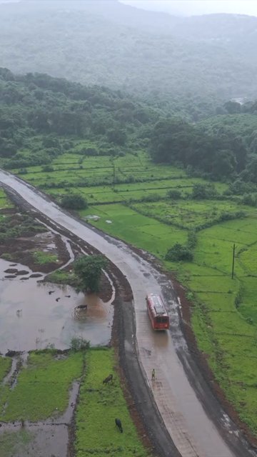 Vertical Aerial View of Lush Green Hills and Winding Roads in Ratnagiri Maharashtra India