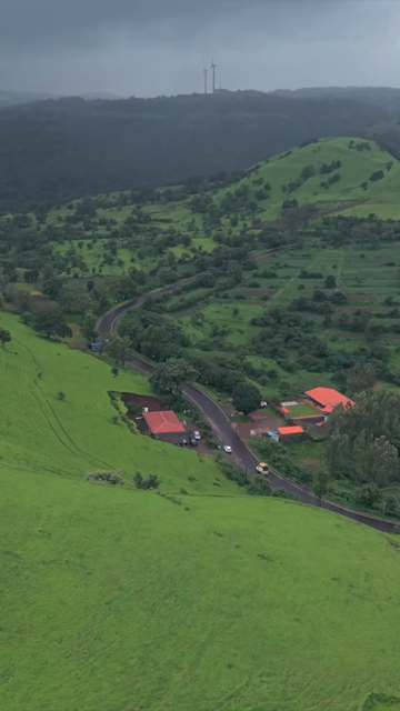Vertical Aerial View of Lush Green Hills and Winding Roads in Ratnagiri Maharashtra India