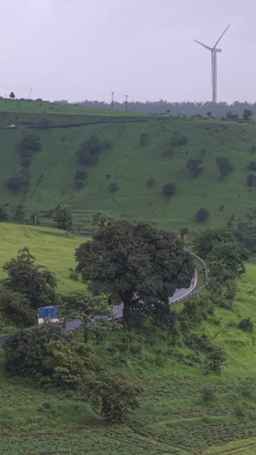 Vertical Aerial View of Lush Green Hills and Winding Roads in Ratnagiri Maharashtra India