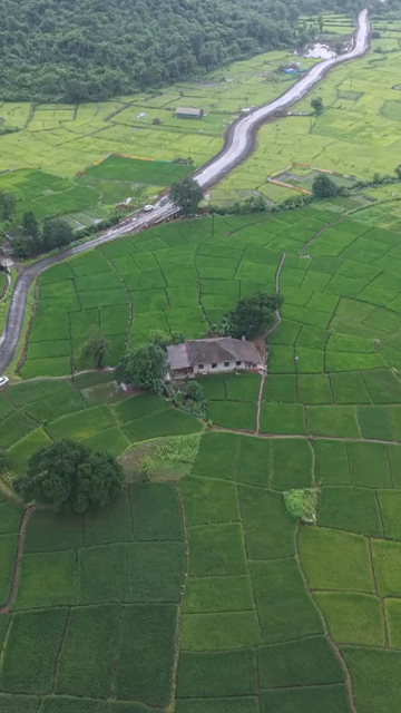 Vertical Aerial View of Lush Green Hills and Winding Roads in Ratnagiri Maharashtra India