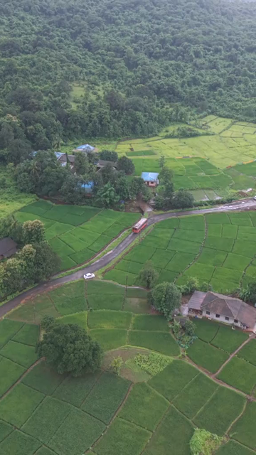 Vertical Aerial View of Lush Green Hills and Winding Roads in Ratnagiri Maharashtra India