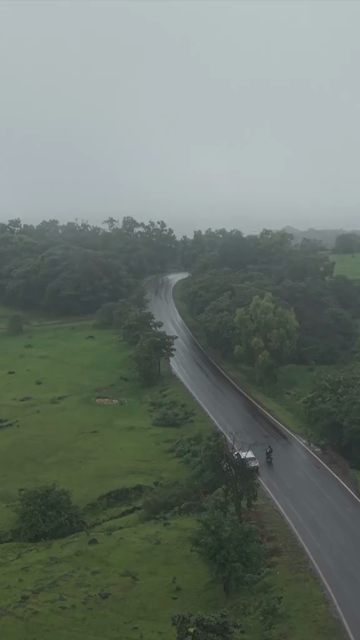 Vertical Aerial View of Lush Green Hills and Winding Roads in Ratnagiri Maharashtra India