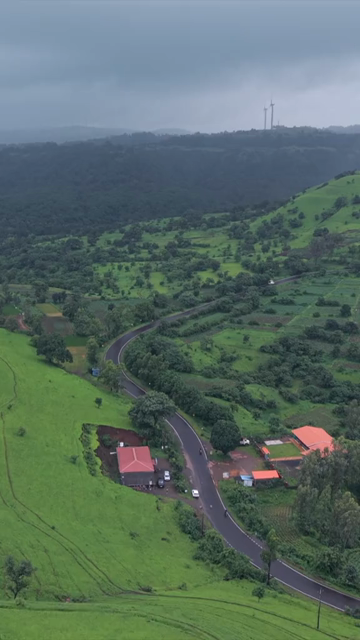 Vertical Aerial View of Lush Green Hills and Winding Roads in Ratnagiri Maharashtra India