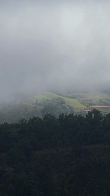 Vertical Aerial View of Hosahalli Gudda and Misty Western Ghats Sakleshpur Karnataka