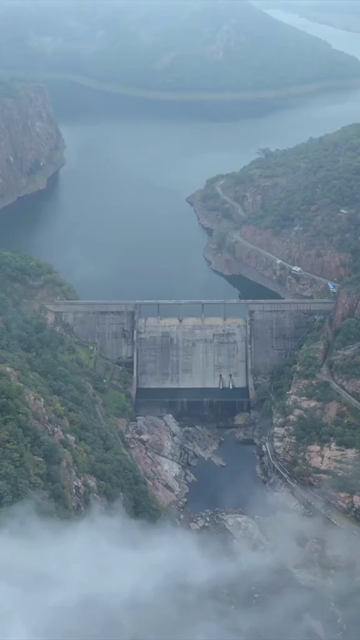 Vertical Aerial View of Jakham Dam and Misty Forested Hills Pratapgarh Rajasthan India