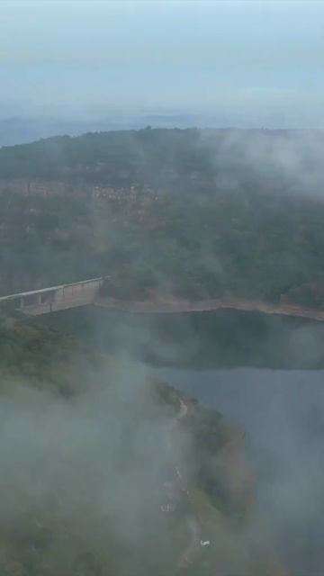 Vertical Aerial View of Jakham Dam and Misty Forested Hills Pratapgarh Rajasthan India