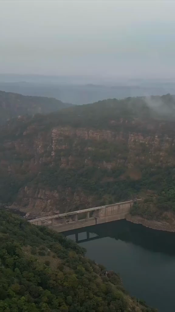 Vertical Aerial View of Jakham Dam and Misty Forested Hills Pratapgarh Rajasthan India