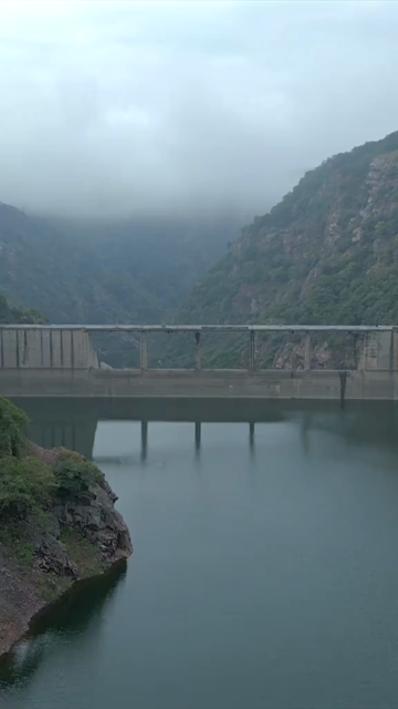 Vertical Aerial View of Jakham Dam and Misty Forested Hills Pratapgarh Rajasthan India