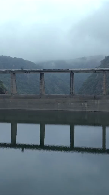 Vertical Aerial View of Jakham Dam and Misty Forested Hills Pratapgarh Rajasthan India