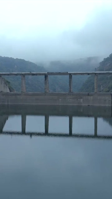 Vertical Aerial View of Jakham Dam and Misty Forested Hills Pratapgarh Rajasthan India