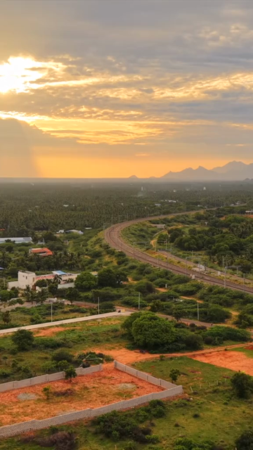 Vertical Aerial View of Kanyakumari Landscape with Railway Track at Sunset Tamil Nadu