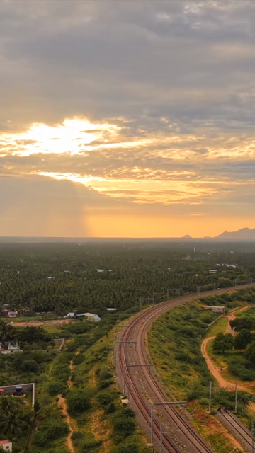 Vertical Aerial View of Kanyakumari Landscape with Railway Track at Sunset Tamil Nadu