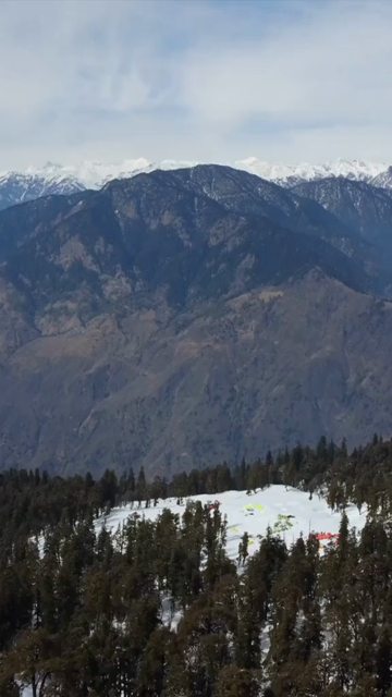 Vertical Aerial View of Kedarkantha Trek Snow Camp and Himalayan Mountains Uttarakhand