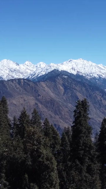 Vertical Aerial View of Kedarkantha Trek Snow Camp and Himalayan Mountains Uttarakhand