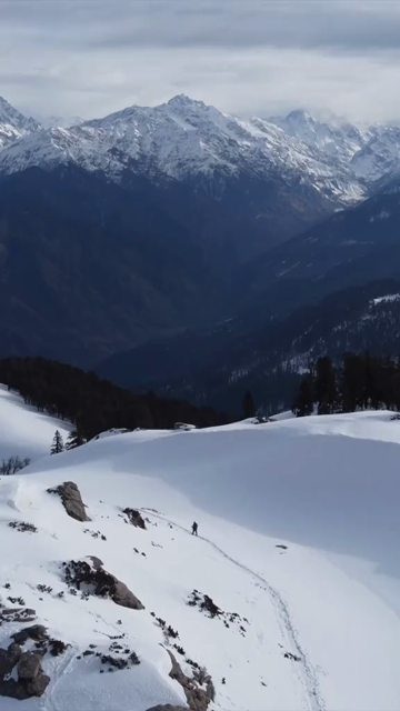 Vertical Aerial View of Kedarkantha Trek Snow Camp and Himalayan Mountains Uttarakhand