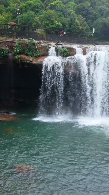 Vertical Aerial View of Krang Suri Falls and Lush Forest Landscape Meghalaya