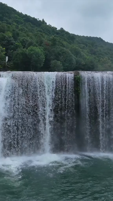 Vertical Aerial View of Krang Suri Falls and Lush Forest Landscape Meghalaya